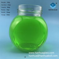 Wholesale 330ml flat drum shaped honey glass bottle